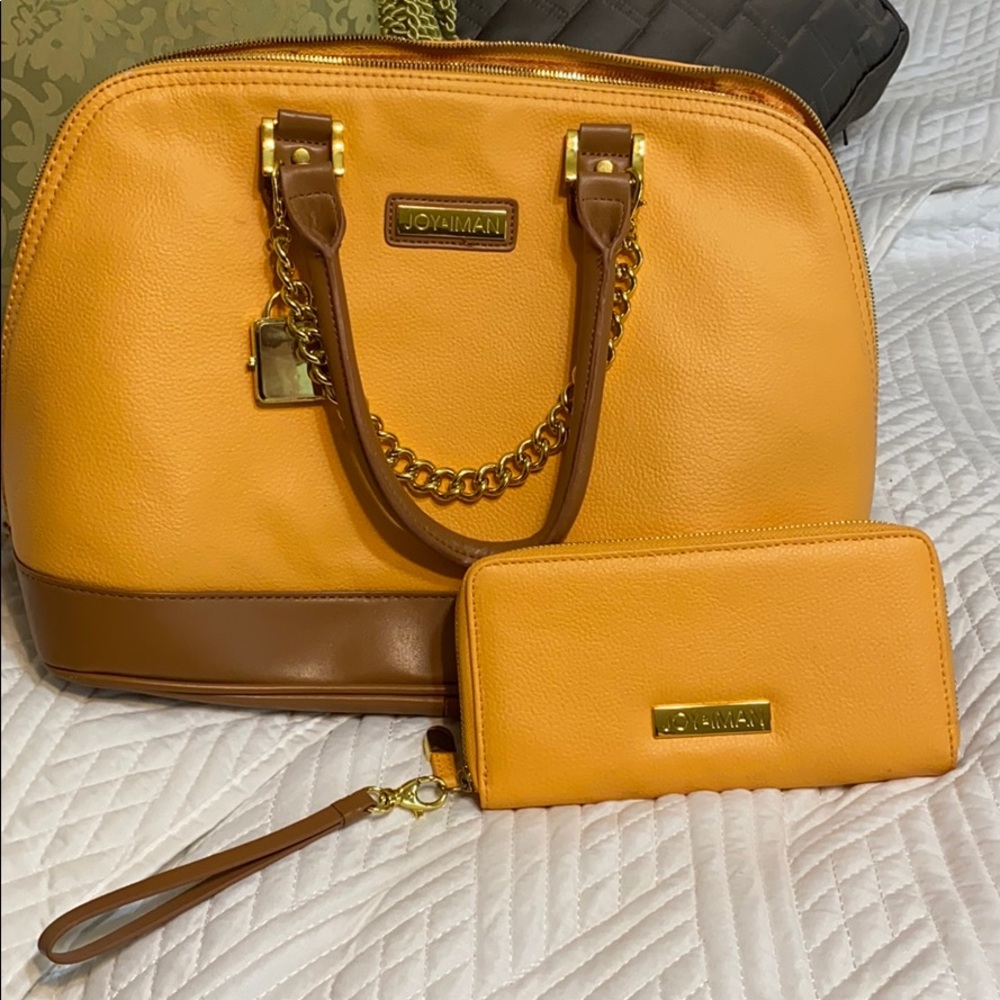 Joy & Iman Satchel Double-rolled handles.